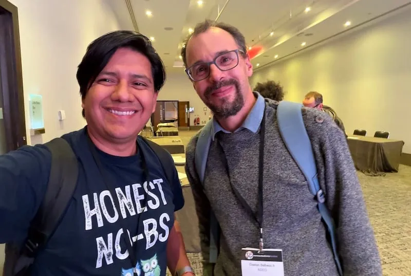 Joe Stainke from gdotv photobombs Juan Sequeda at Connected Data London